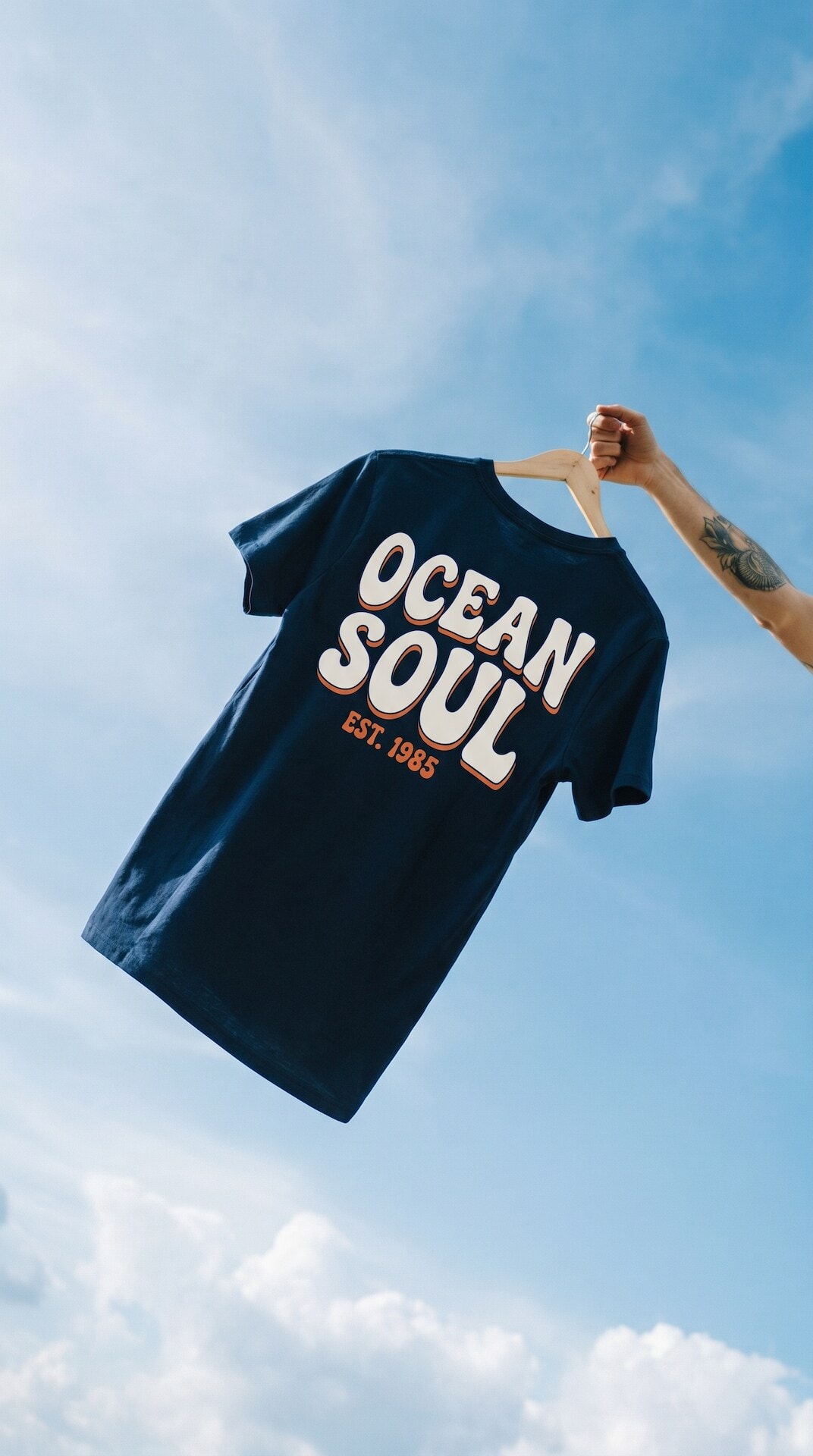 T-Shirt Held Against Sky