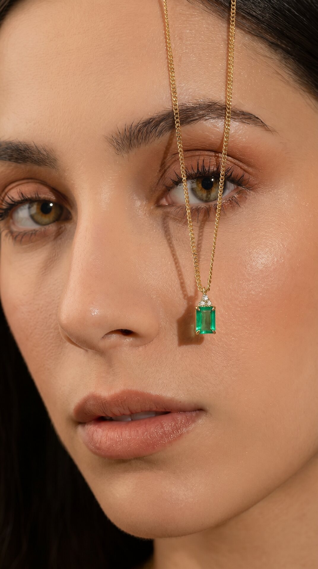 Emerald Pendant Face Closeup