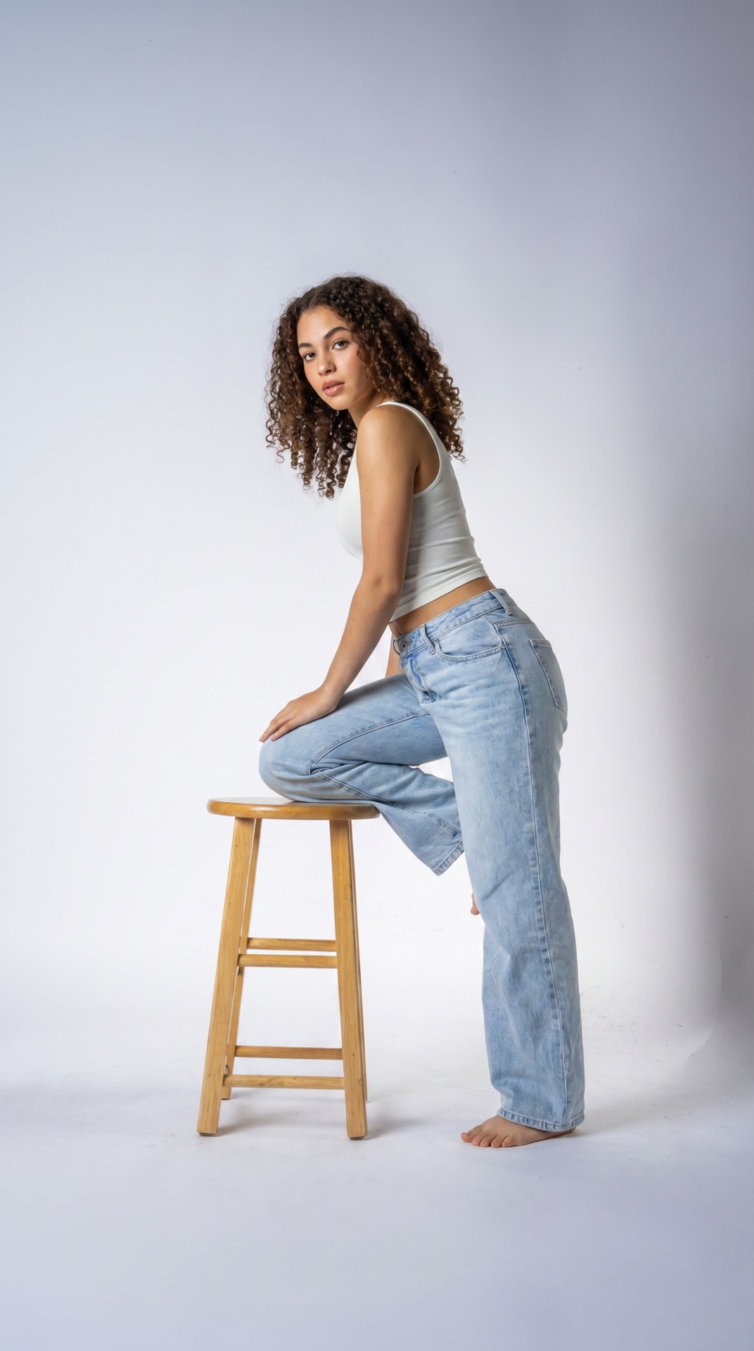 White Tank Denim Stool Side Pose