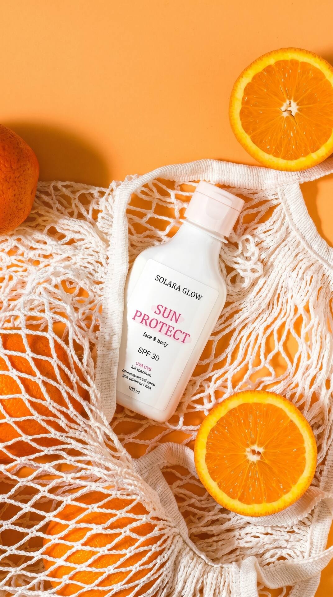 Orange Net Sunscreen Flatlay